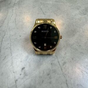 Bulova new 8-diamond black dial, gold-tone stainless steel case and bracelet.